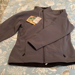 Nice light weight winter jacket. Never worn. Fits TTS